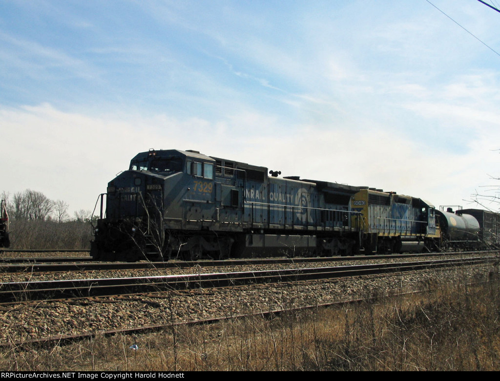 CSX 7329 & 6040 wait to get into the yard